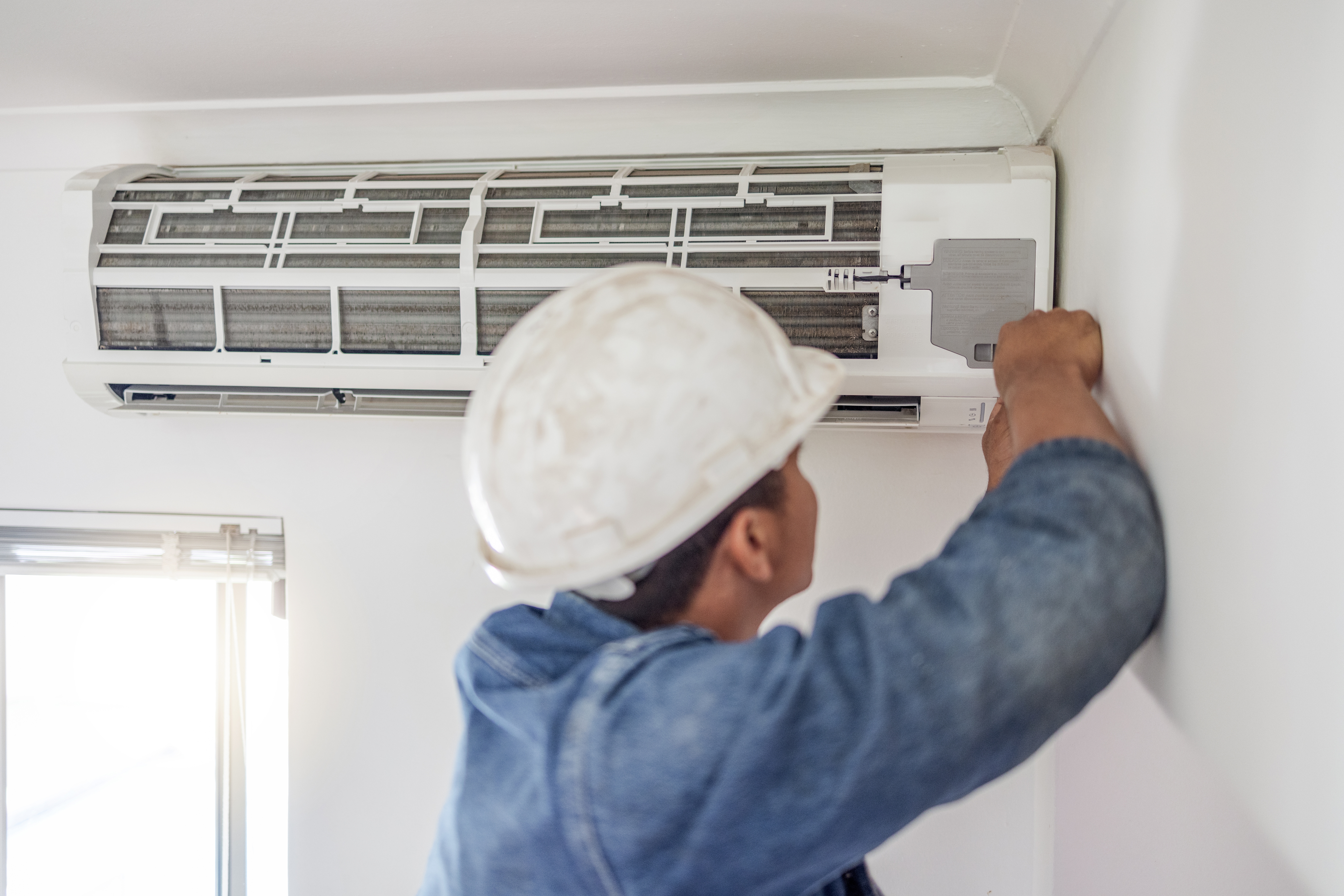 AC repair services fixing air conditioner to restore cooling performance