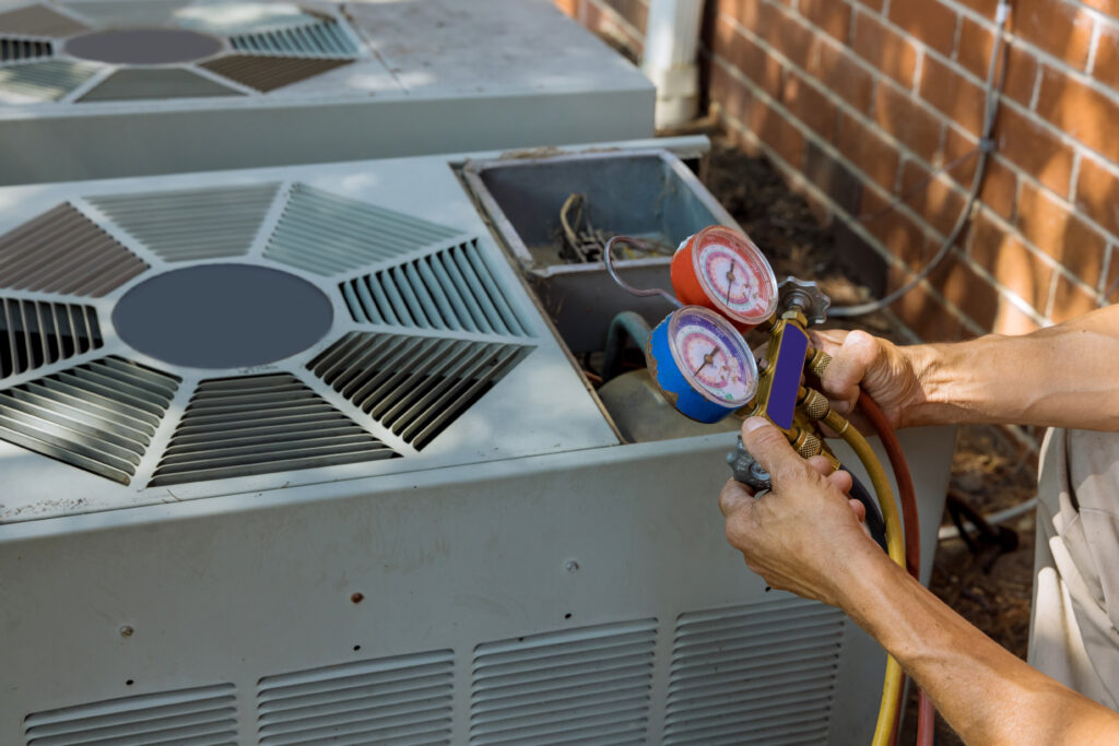 HVAC technician inspecting electrical components after a homeowner reports that their AC smells like burning plastic, indicating a potential electrical HVAC failure.